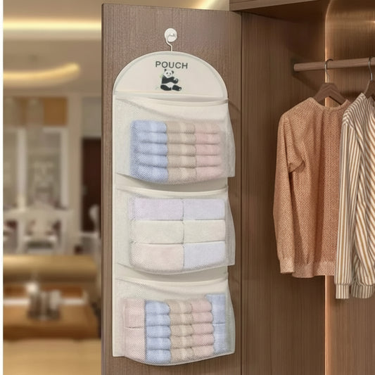 Hanging pouch organizer with towels on a wooden door, showing text 'Comes with hook design' and 'Hanging saves space'.