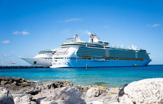 a cruise ship docked at a dock in the ocean