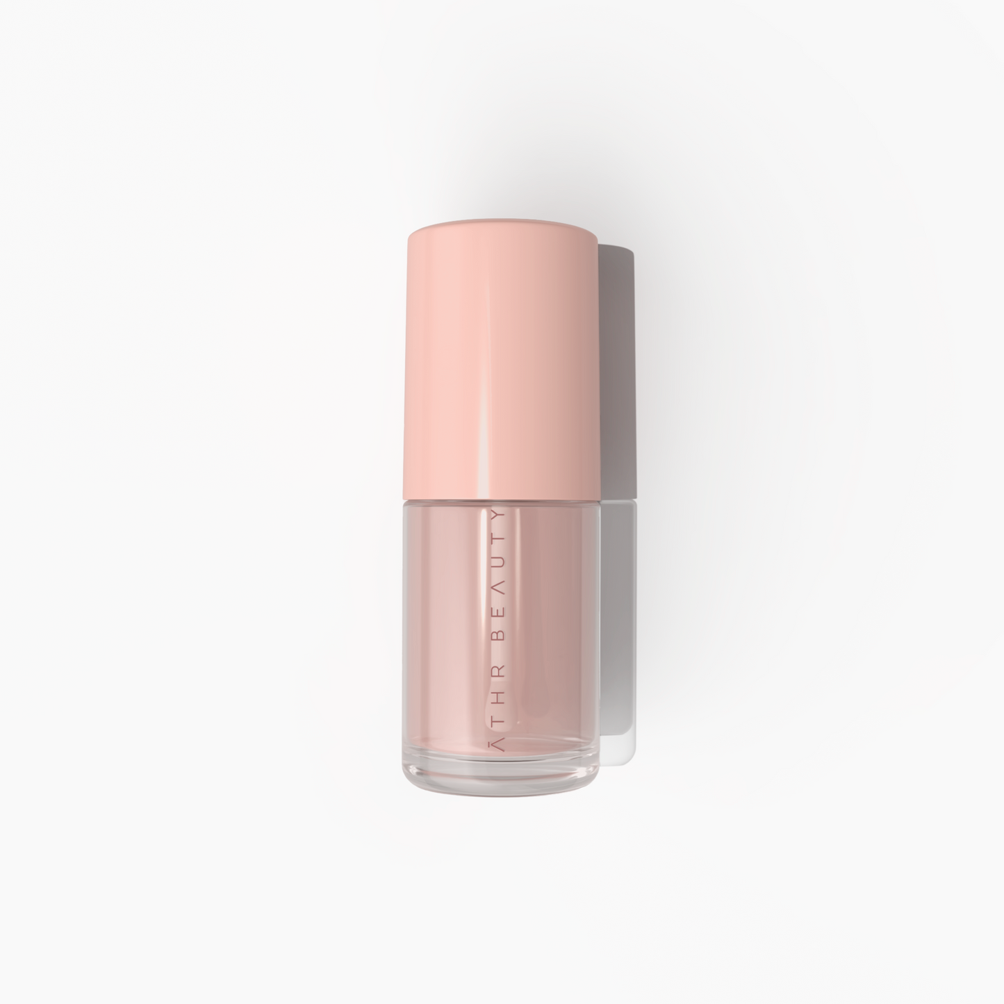 Pink bottle of skincare product with 'Athe Beauty' branding on a white background