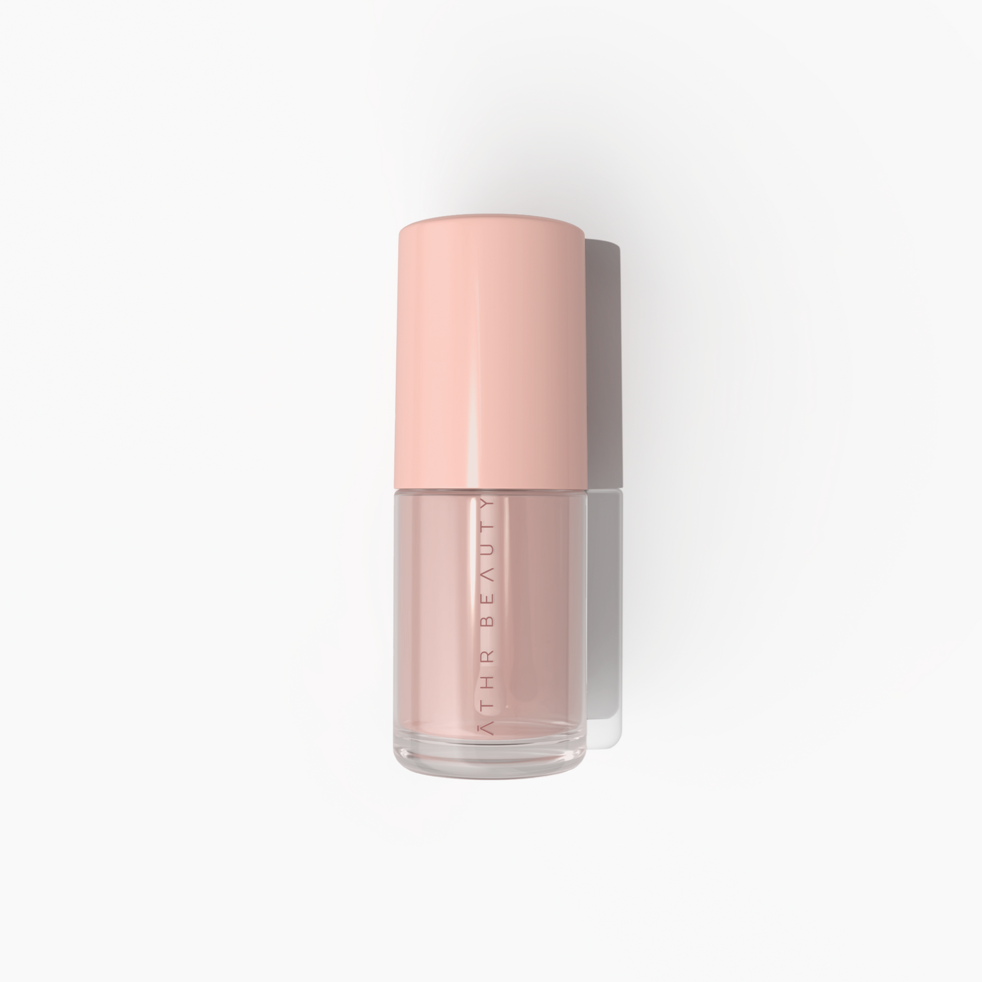 Pink bottle of skincare product with 'Athe Beauty' branding on a white background