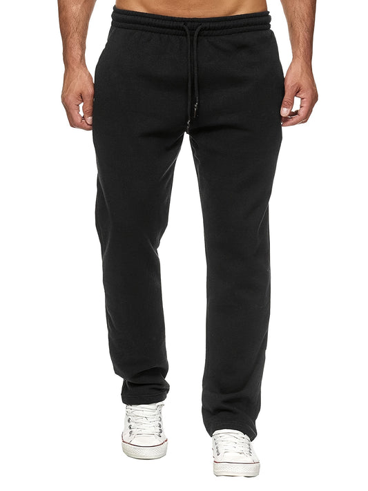 Black sweatpants worn by a person on a white background