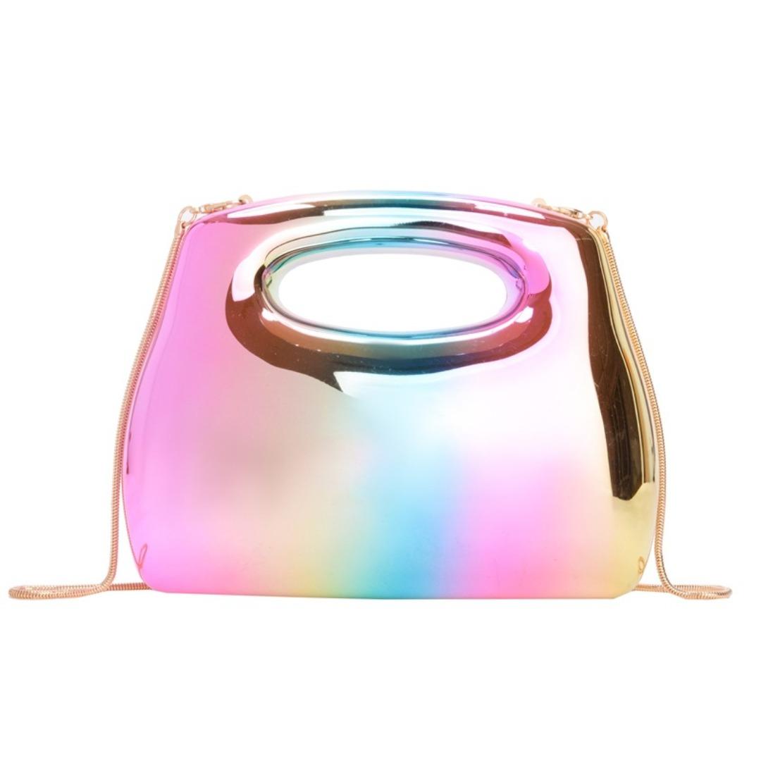 Multicolored transparent handbag with a gold strap on a white background