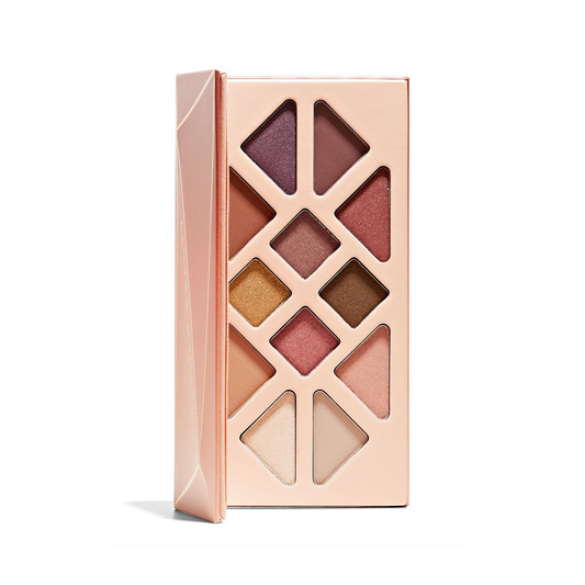 Makeup eyeshadow palette with various shades on a white background