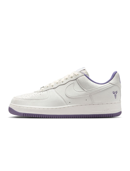 White sneaker with purple accents on a white background