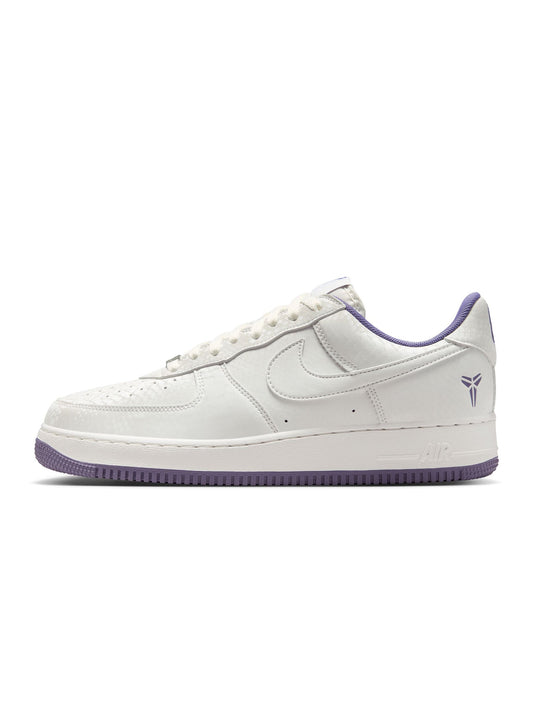 White sneaker with purple accents on a white background