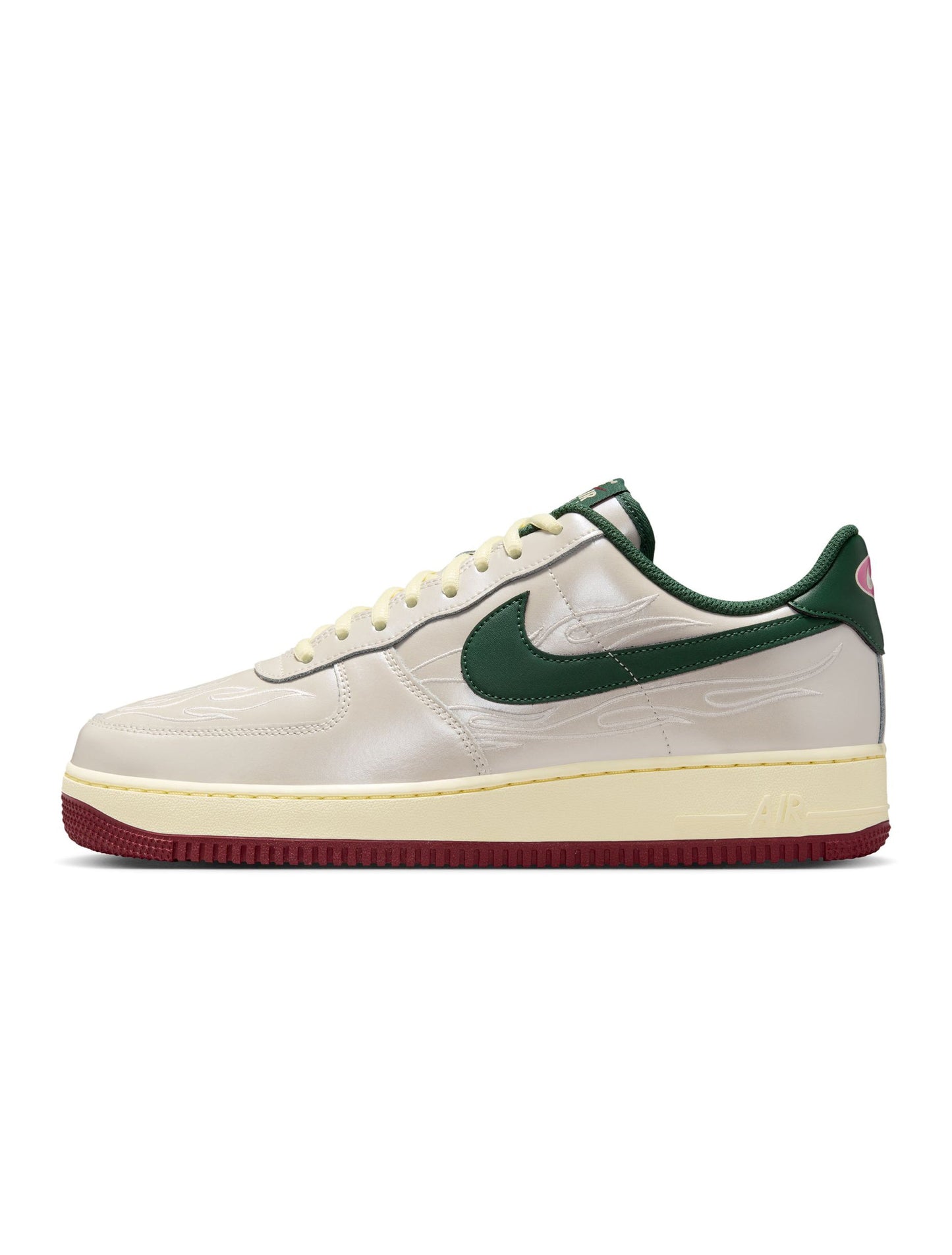 White sneaker with green accents on a white background