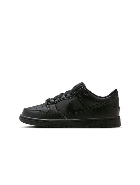 Brown sneaker with black sole on a white background