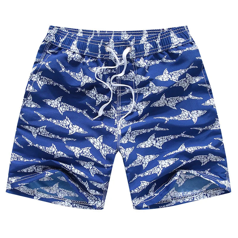 Blue swim shorts with white shark pattern on a white background