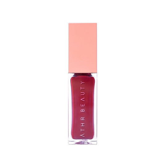Lipstick with pink cap and visible brand name on a white background