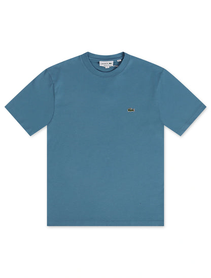 Blue t-shirt with a brand logo on a white background