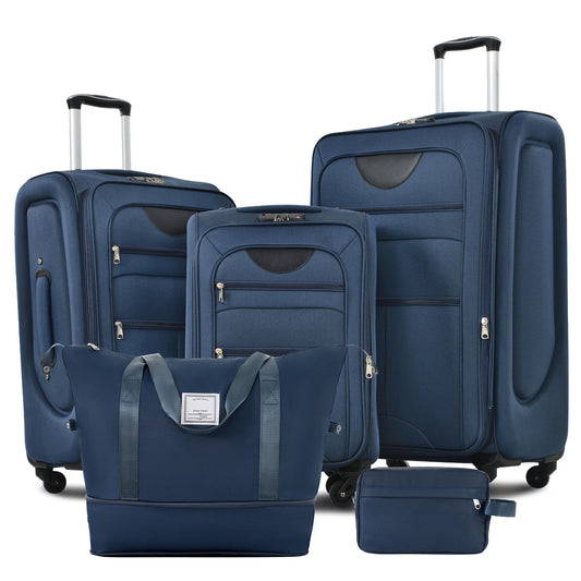 Set of blue luggage including suitcases and a handbag on a white background
