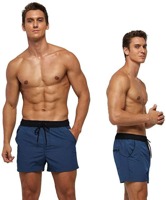 Man wearing blue swim shorts with a black drawstring on a white background