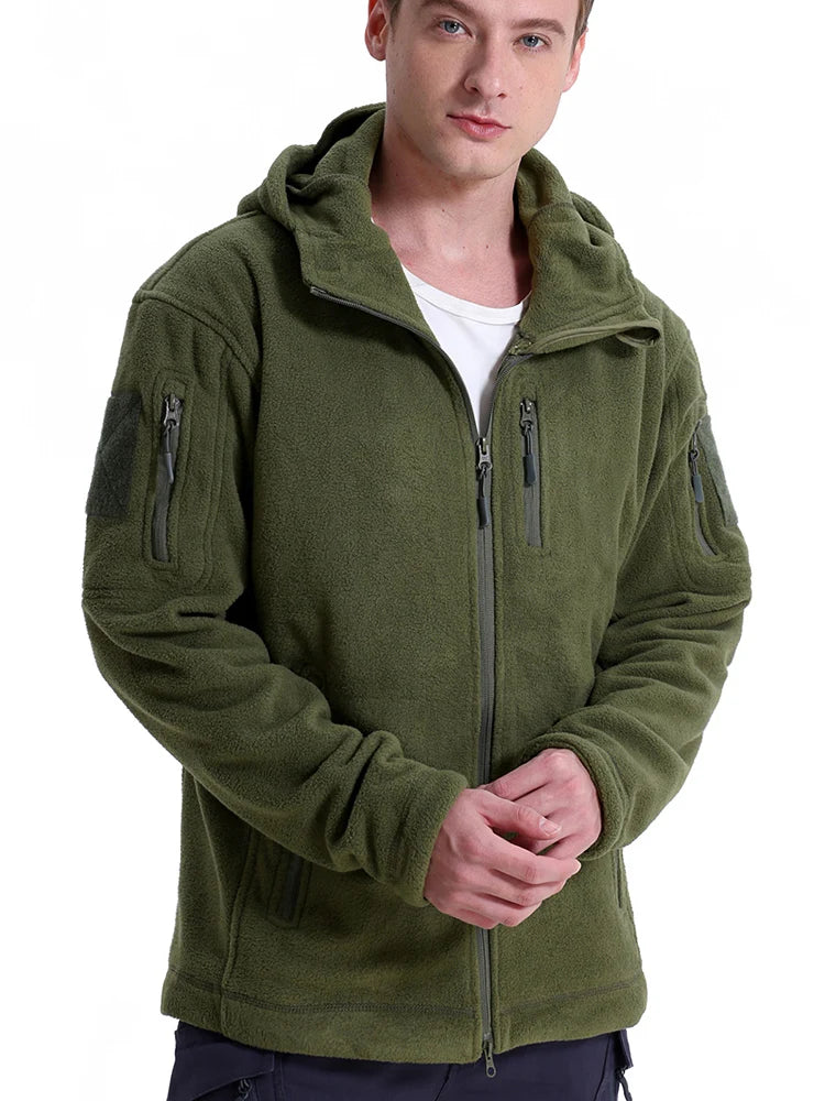 Man wearing a green fleece jacket with zippers and pockets on a white background