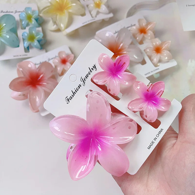 Flower-shaped hair accessories on cards with 'Fashion Jewelry' branding.