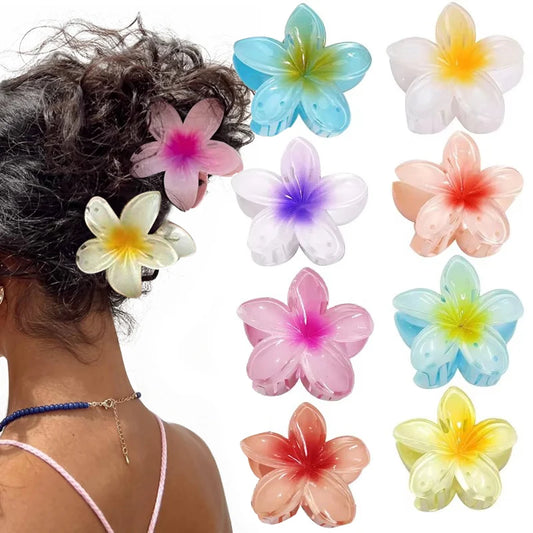 Colorful flower-shaped hair accessories on a person's head with additional flowers displayed.