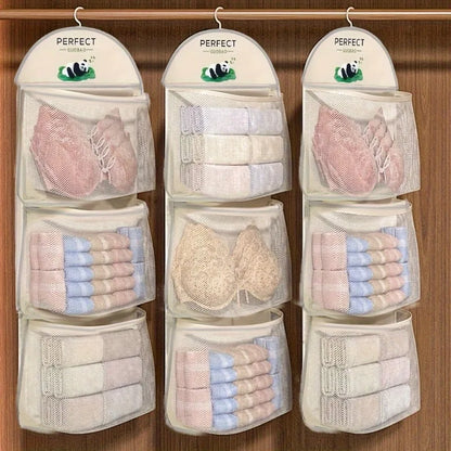 Three hanging mesh organizer pockets on a wooden closet door, each filled with folded towels, washcloths, and lace bra cups. Each pocket has a white header card printed with the brand name PERFECT and a small panda logo.