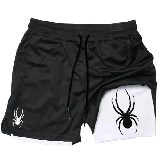 Black shorts with spider design on a white background
