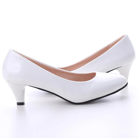 White high-heeled shoes on a white background