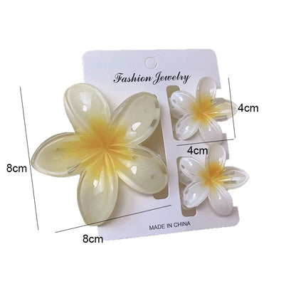 Flower-shaped hair accessories on a 'Fashion Jewelry' card with measurements.