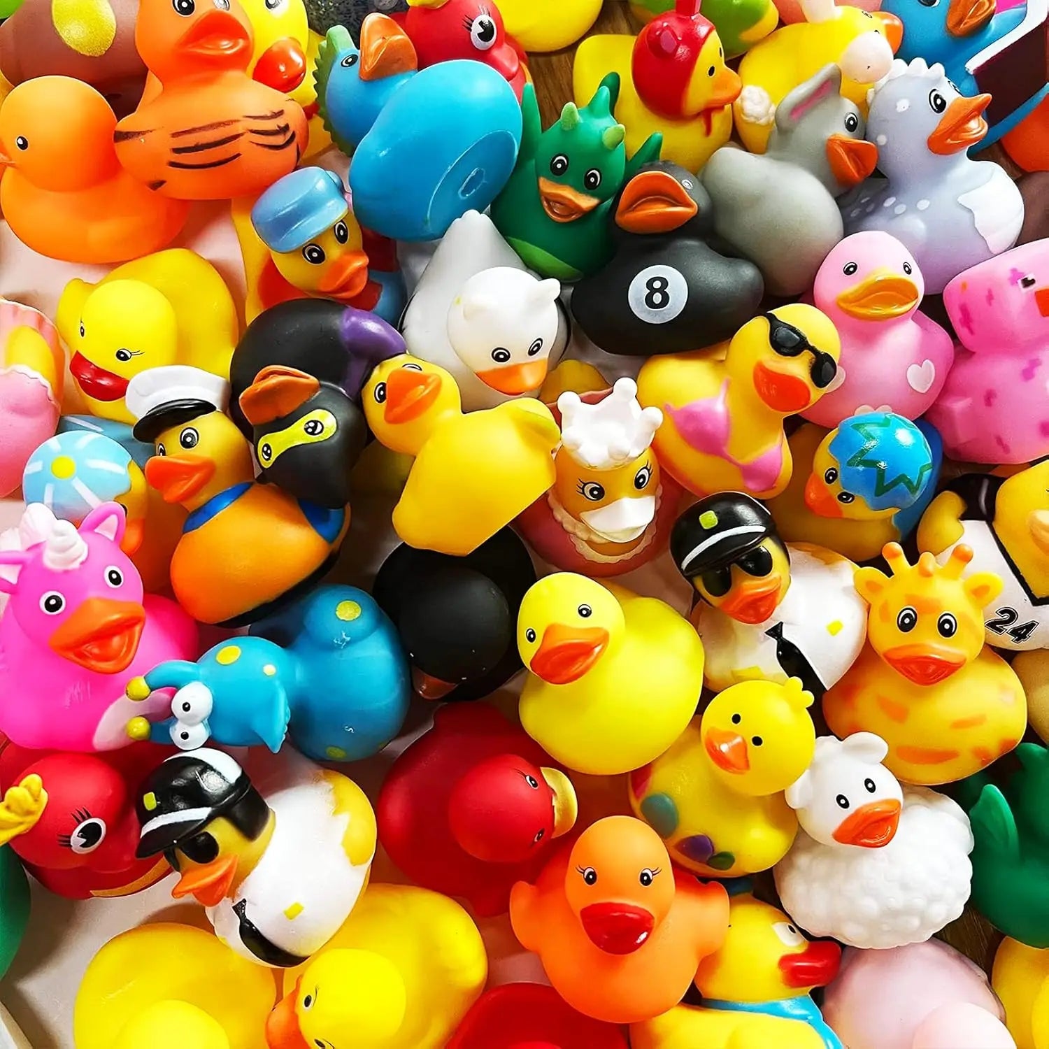 Assorted colorful rubber duck toys with various designs and hats.