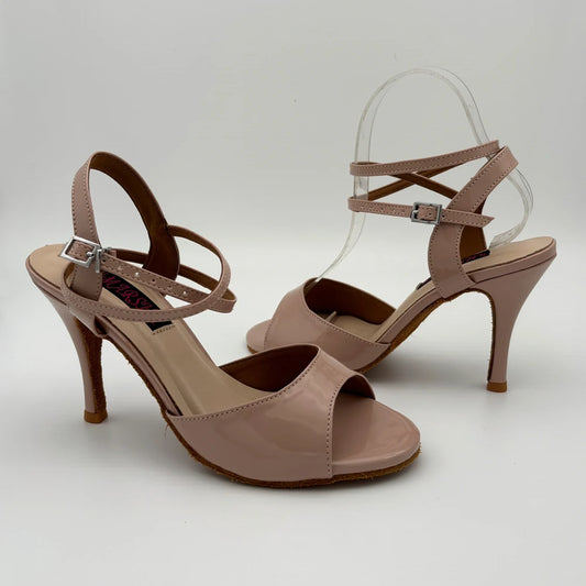 Pair of brown high-heeled sandals on a light gray background