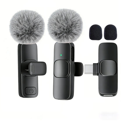 Set of three microphones with fuzzy covers on a white background