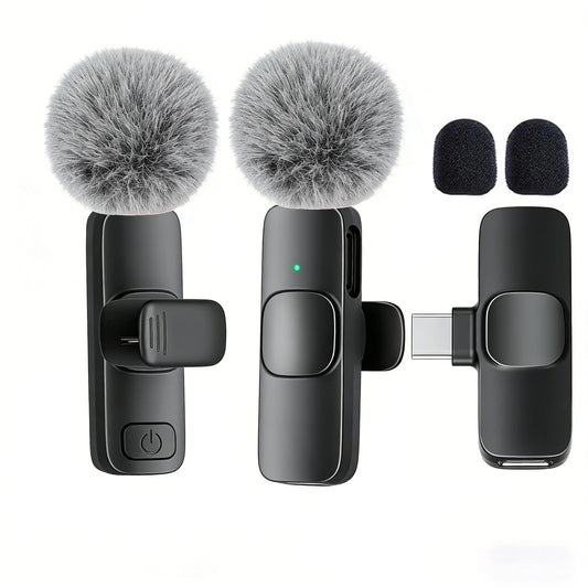 Set of three microphones with fuzzy covers on a white background