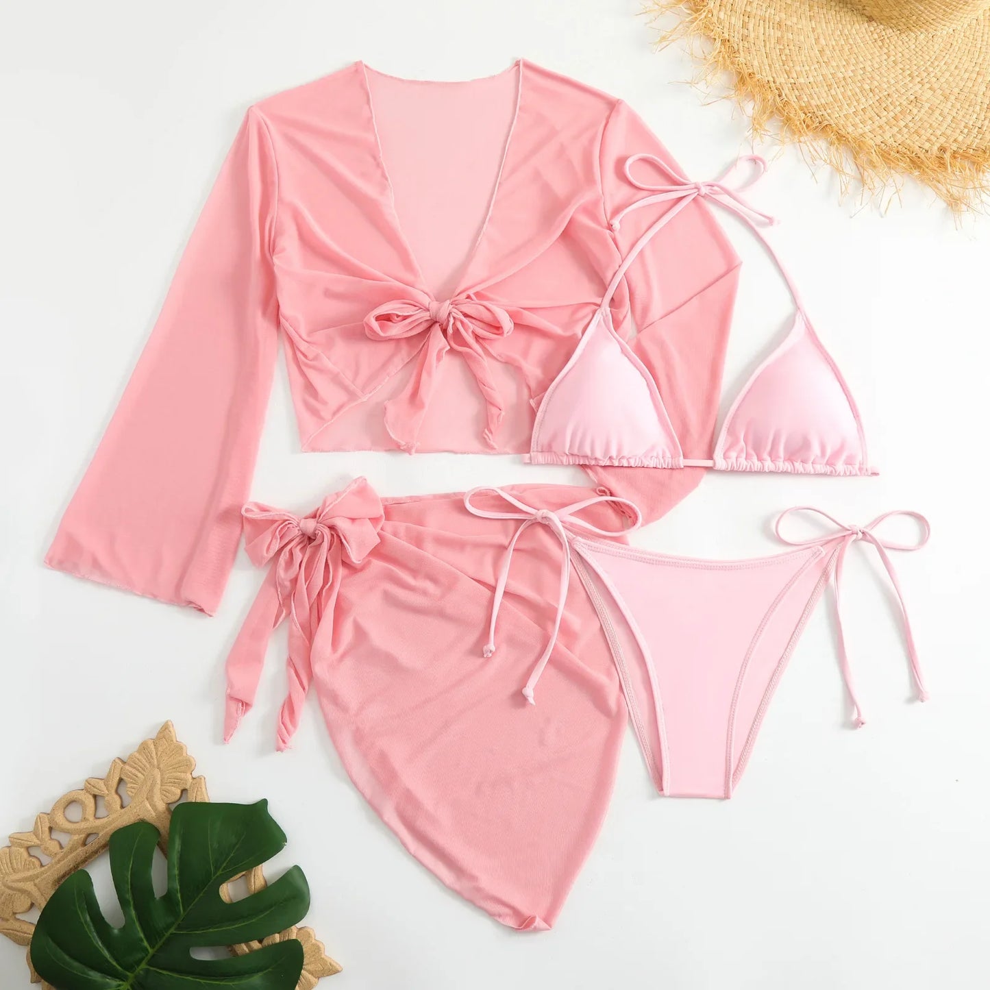 Pink bikini set with matching cover-up on a white background