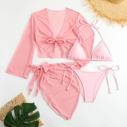 Pink bikini set with matching cover-up on a white background