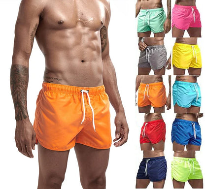 Man wearing orange swim shorts with a grid of other colored swim shorts on a white background