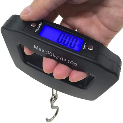 Digital luggage scale held by a hand with a white background