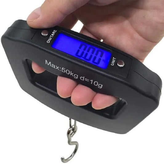 Digital luggage scale held by a hand with a white background