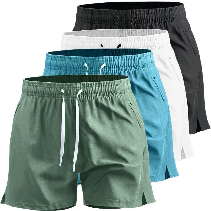 Four pairs of shorts in green, blue, black, and white on a white background