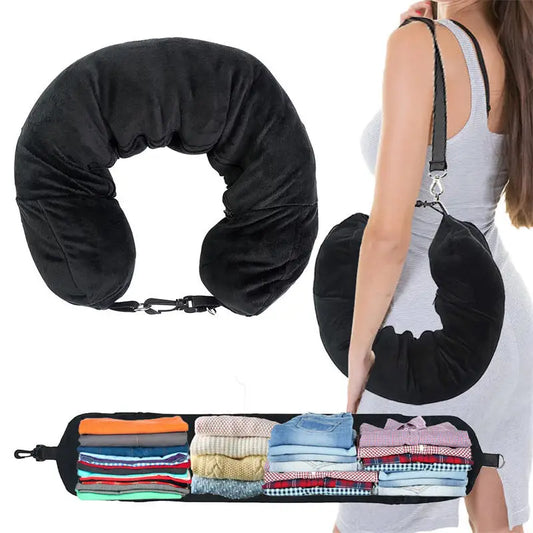 Black travel neck pillow with a carrying case filled with clothes on a white background