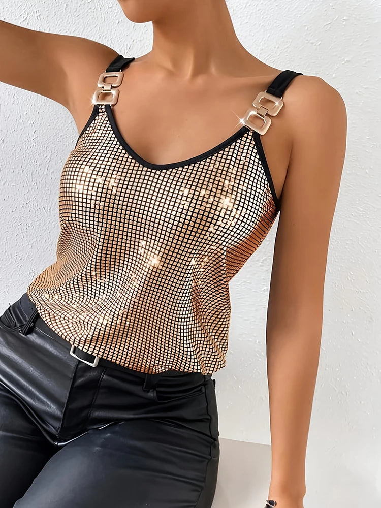Gold sequin cami with buckle chain straps styled with black leather pants