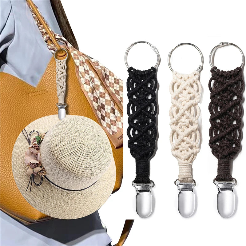 Macramé hat clip keychain holding straw hat on tan travel tote bag