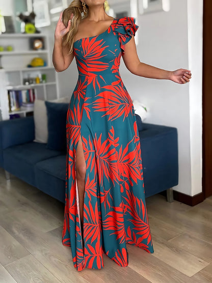 Woman wearing a blue and red floral dress in a living room setting