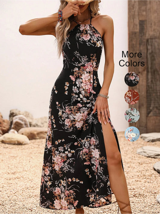 Woman wearing a black floral dress with a slit on a beach.
